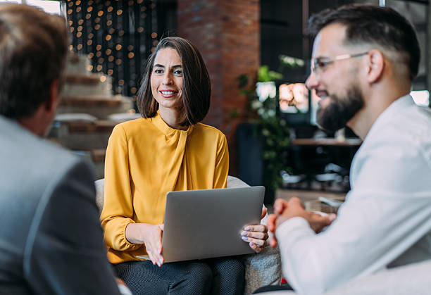 istock Group of business persons talking in the office. 2254860595