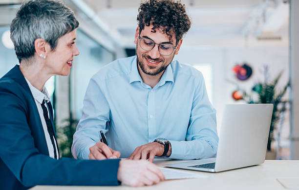 istock Business people signing a contract in the office. 2254861212
