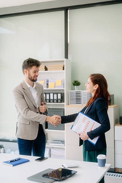 istock business people shaking hands during a meeting in office 2254862346