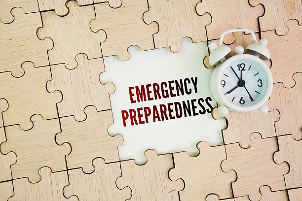 istock Clock and wooden puzzle with the word Emergency Preparedness 2254864288