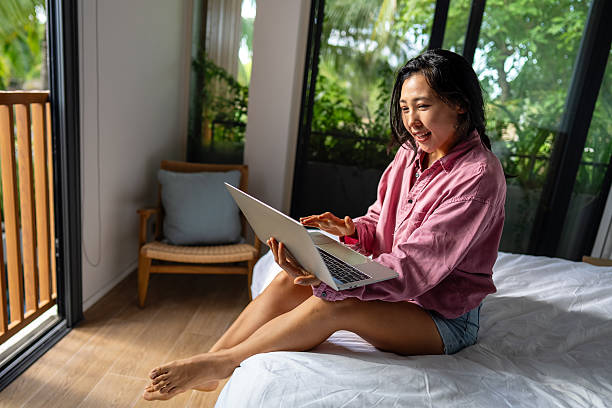 istock Happy young woman working remotely from home, enjoying a relaxed and comfortable atmosphere 2254864544
