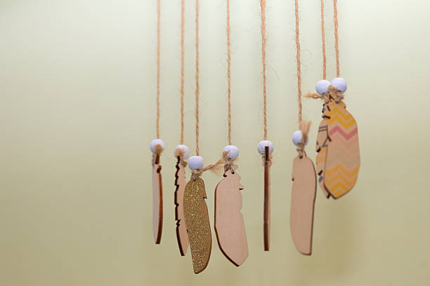 istock Wooden Ornaments Hanging on Strings 2254864646