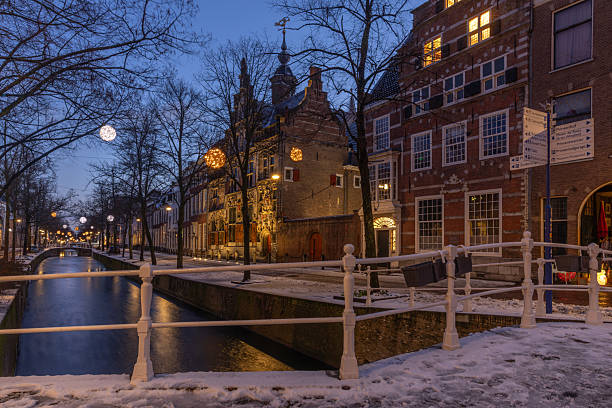 istock Snow covered Delft roads and architecture on a wintry blue sky night 2254873454