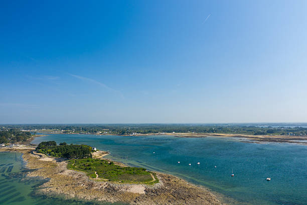 istock Rocky peninsula and blue bay under clear sky 2254873502
