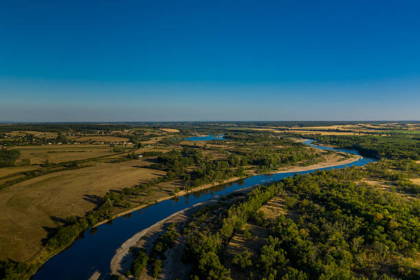 istock Golden fields and Loire river under blue sky 2254873541
