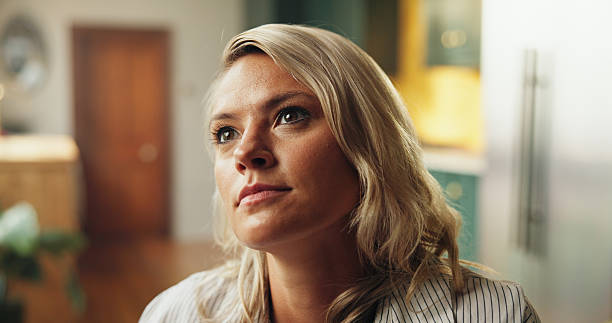 istock Thinking, memory and woman in home for relax, reflection and calm in morning on weekend. Planning, dreaming and female person in living room for break with decision, choice or ideas in apartment. 2254876768