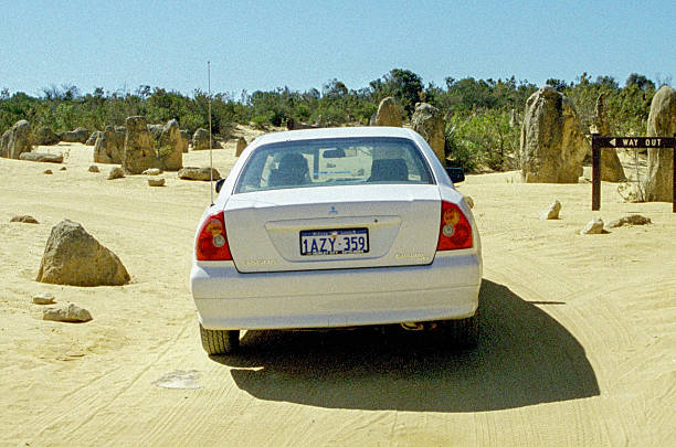 Historical photograph from 2001: A white Mitsubishi Magna Executive V6 (third generation, built from 1996) manufactured by Mitsubishi Motors Australia in Tonsley Park, South Australia, in a parking lot in Monkey Mia.