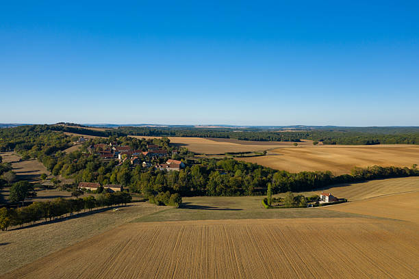 istock Rural village and golden fields in late summer 2254881603