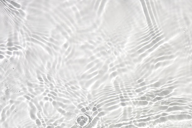 Soft ripples on the surface of clear water.