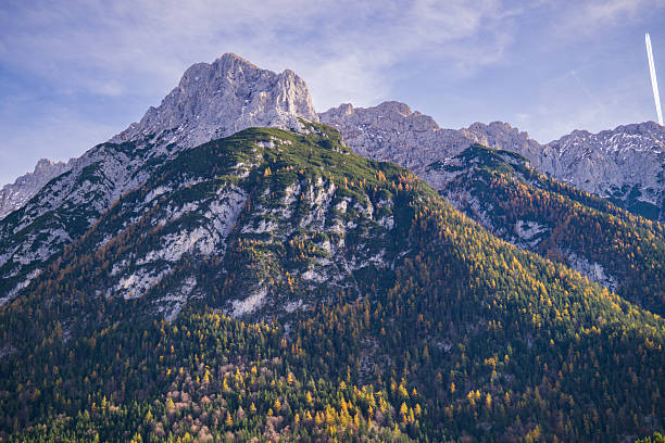 View from Garmisch-Partenkirchen, (Bavaria) of the mountain Alpspitze, the Alpspitze is 2628 meters (8622 ft)  high and is located next to the Zugspitze, Germany's highest mountain which is 2962 meters (9717 ft) high.\nSee the little red dot in the middle of the mountain, this is a paraglider.