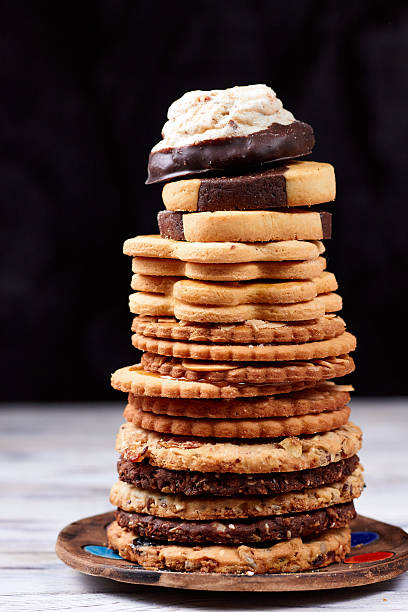 istock Stack of assorted cookies on white wooden boards 2254900928