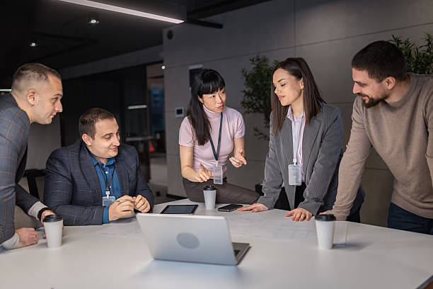 istock Diverse business team collaborating over laptop in modern office 2254910548