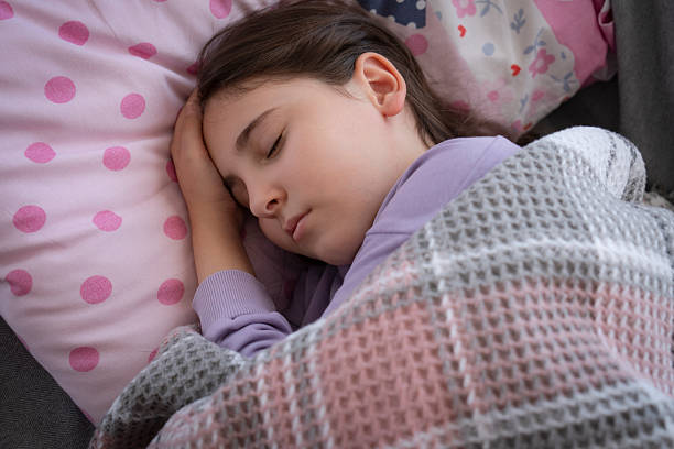 Deep sleeping children girl close up portrait