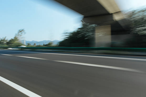 Urban cityscape view from bridge ground perspective with distant CBD skyline, wide copy space for car advertising background, modern city scenery suitable for commercial promotion, transportation branding, outdoor advertising design and minimalist layout