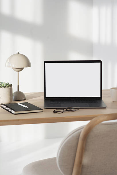 istock Laptop with blank empty screen mockup at home office 2254921235