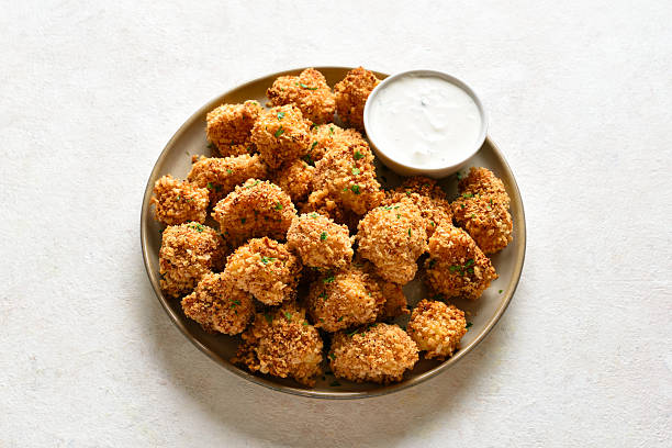 istock Crispy breaded oven baked cauliflower bites served with dipping sauce 2254930496