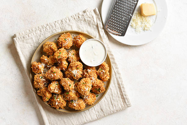 istock Crispy breaded oven baked cauliflower bites served with dipping sauce 2254930867