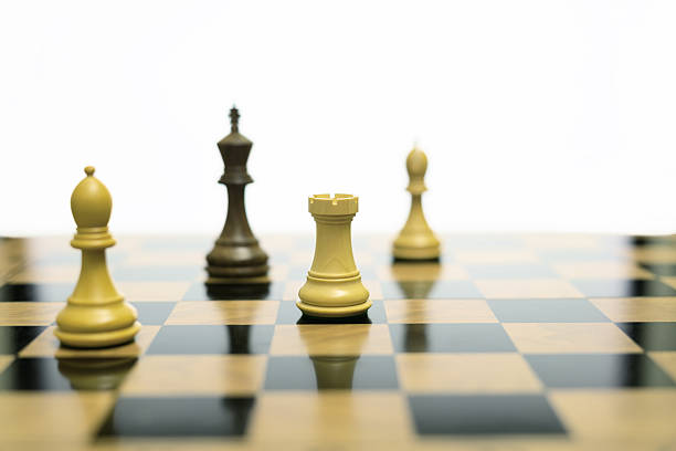 A black chess king stands confined near the board edge, surrounded by opposing pieces, conveying inevitability, pressure, and slow strategic collapse within an ordered system.