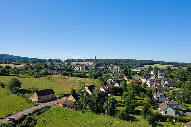 istock Charming countryside village with church and fields 2254931583