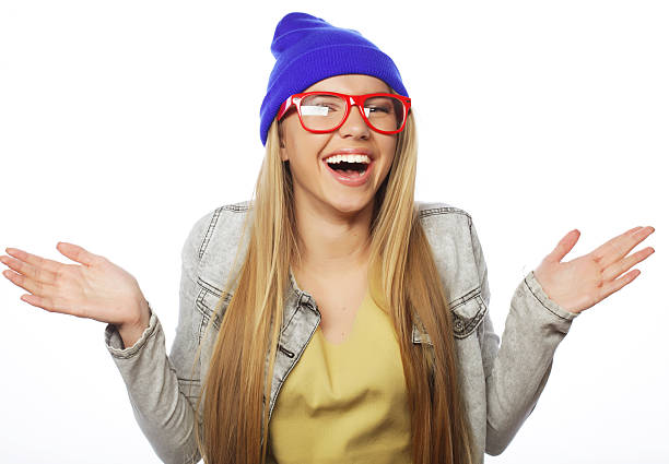 Woman, winter and beanie with smile in city while on vacation, travel or holiday happy to relax away from home. Girl, happiness and teeth zoom of face for beauty against urban background in Cape Town