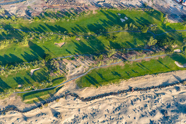 Aerial view of Maspalomas Golf Course and Sand Dunes Nature Reserve, Gran Canaria, Canary Islands - 4K Cinematic Flyover