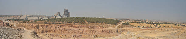 Panoramic view of a pit line and a processing plant at horizon