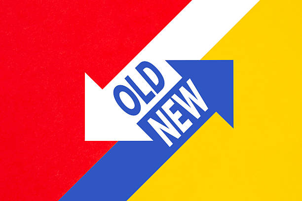 Conceptual shot with arrows on red and yellow paper background for choice concept
