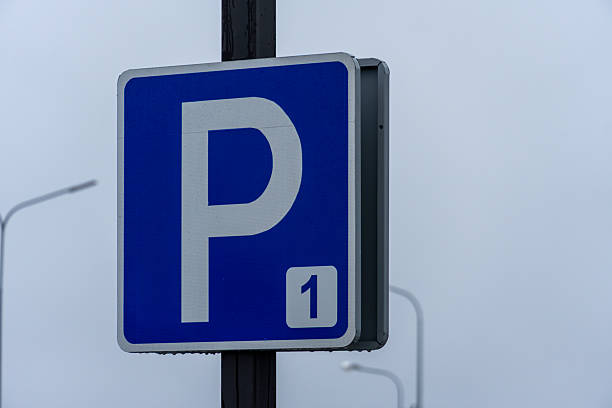 istock A blue parking sign marked with a bold 'P' indicates available parking on a dreary, overcast day in the city 2254942817