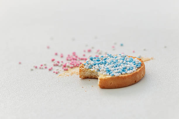 Traditional beschuit with blue and white muisjes Dutch birth announcement treats showing bite for newborn baby boy celebration