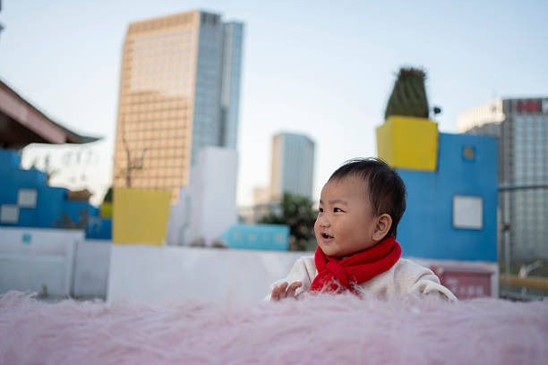Asian babies playing and laughing happily on the terrace