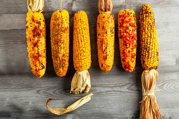 istock Assorted Gourmet Freshly Grilled Corn on the Cob with Various Toppings 2254952632