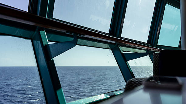 Viewing the open sea from an interior lounge aboard a modern cruise ship