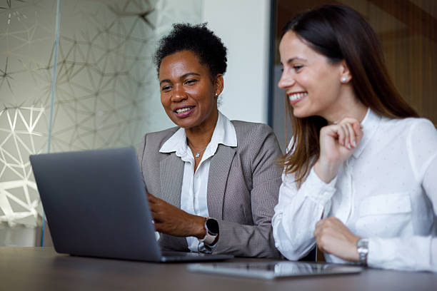 istock Diverse businesswomen collaborating on laptop, working together in modern office, finding solutions, discussing strategies 2254956823