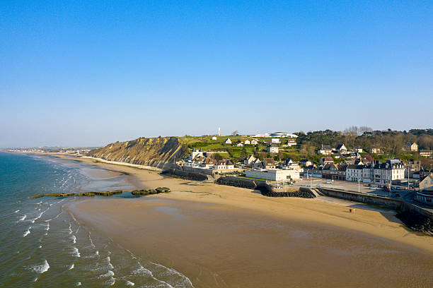 istock Golden beach and village at Arromanches-les-Bains 2254958055