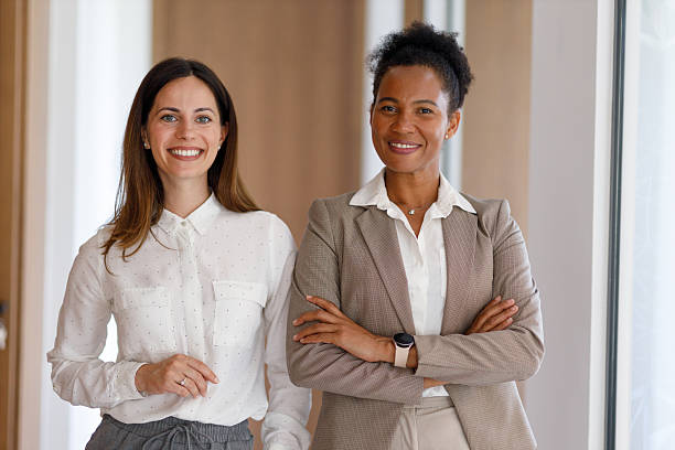 istock Diverse businesswomen smiling, collaborating, creating successful partnership in modern office environment 2254958528