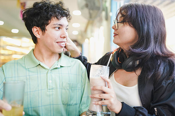 Young couple enjoying true love date in cafe