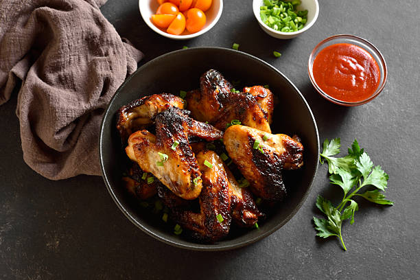 istock Grilled chicken wings in bowl 2254961197