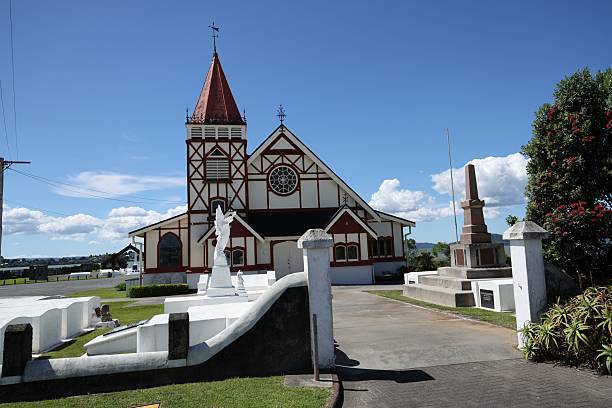 istock Historic Red White Church Cemetery Under Clear Sky 2254961533