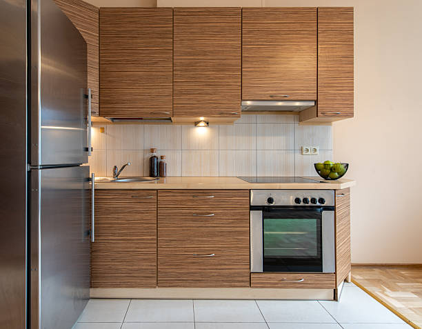 istock Modern Kitchen Interior Design with Wooden Cabinets and Stainless Steel Appliances 2254963421