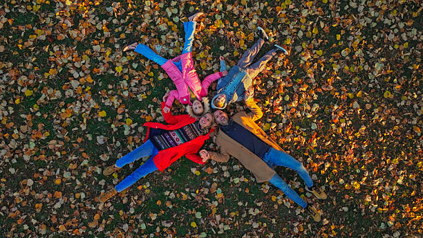 Pupils of the school. Girls with backpacks outdoors. Teens and their mother or teacher. Beginning of lessons. First day of fall.