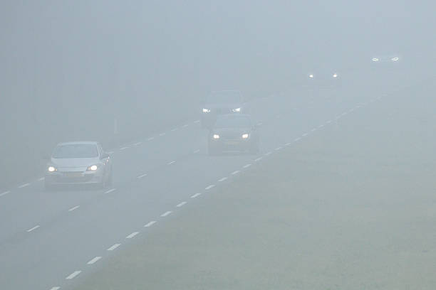 istock Traffic on highway in dense fog with poor visibility 2254969147