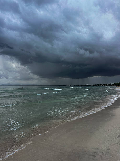 istock Stormy sea with dark clouds over the coastline 2254969168