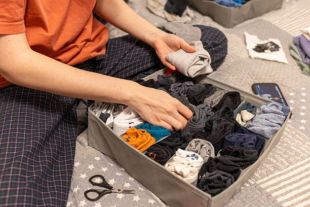 istock woman organizes socks in a drawer divider 2254971213