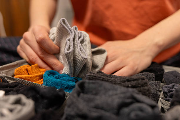 istock woman organizes socks in a drawer divider 2254971285