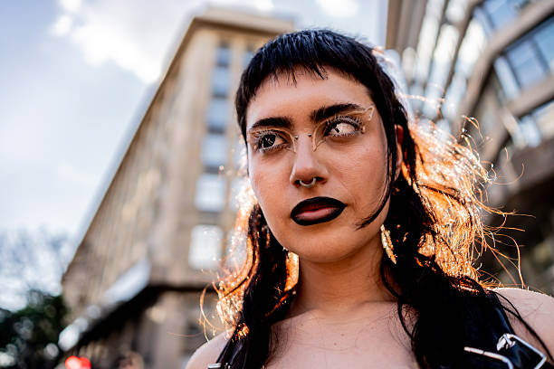 Young lesbian with dark makeup at an LGBTQIA+ pride event.