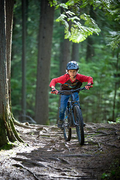 istock Mountain Bike Boy rides Down the Roots 2254974054