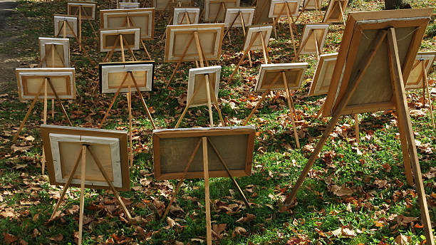 istock Blank canvases on easels - outdoor setup on fallen leaves 2254974276