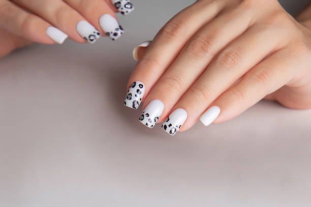 istock Female hands with white manicure nails 2254975450