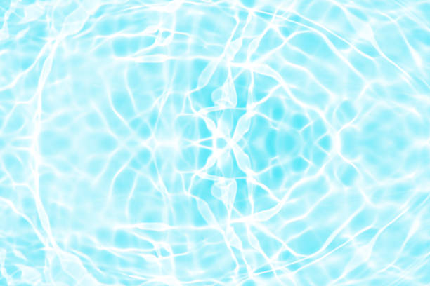 Blur glow background. Light flare. Underwater radiance reflection. Bokeh beam. Defocused blue orange rays flecks texture dark abstract overlay.