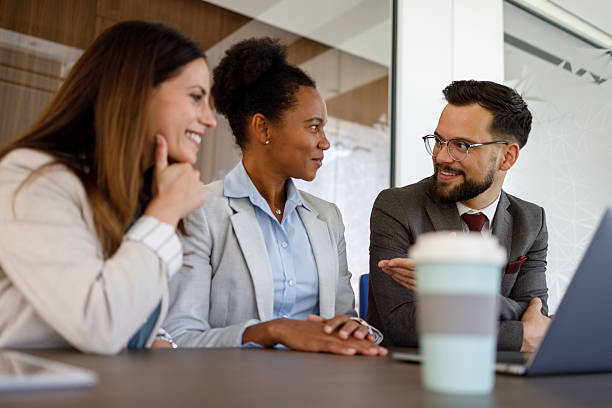 istock Diverse business professionals collaborating in office meeting, sharing ideas and discussing project strategies 2254978409